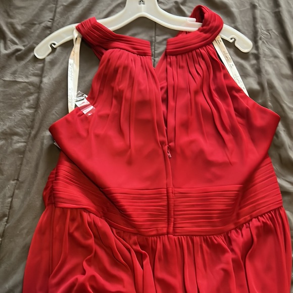 It’s the 2nd bridesmaid dress in candy apple red and it has a split on side - Picture 6 of 6